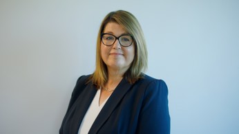 CEO Sam Allen standing at angle