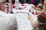 Someone writing down ideas during a focus group